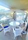 Outdoor Dining, 4 Chairs, Glass Table, Umbrella, Wicker Style Over Aluminum